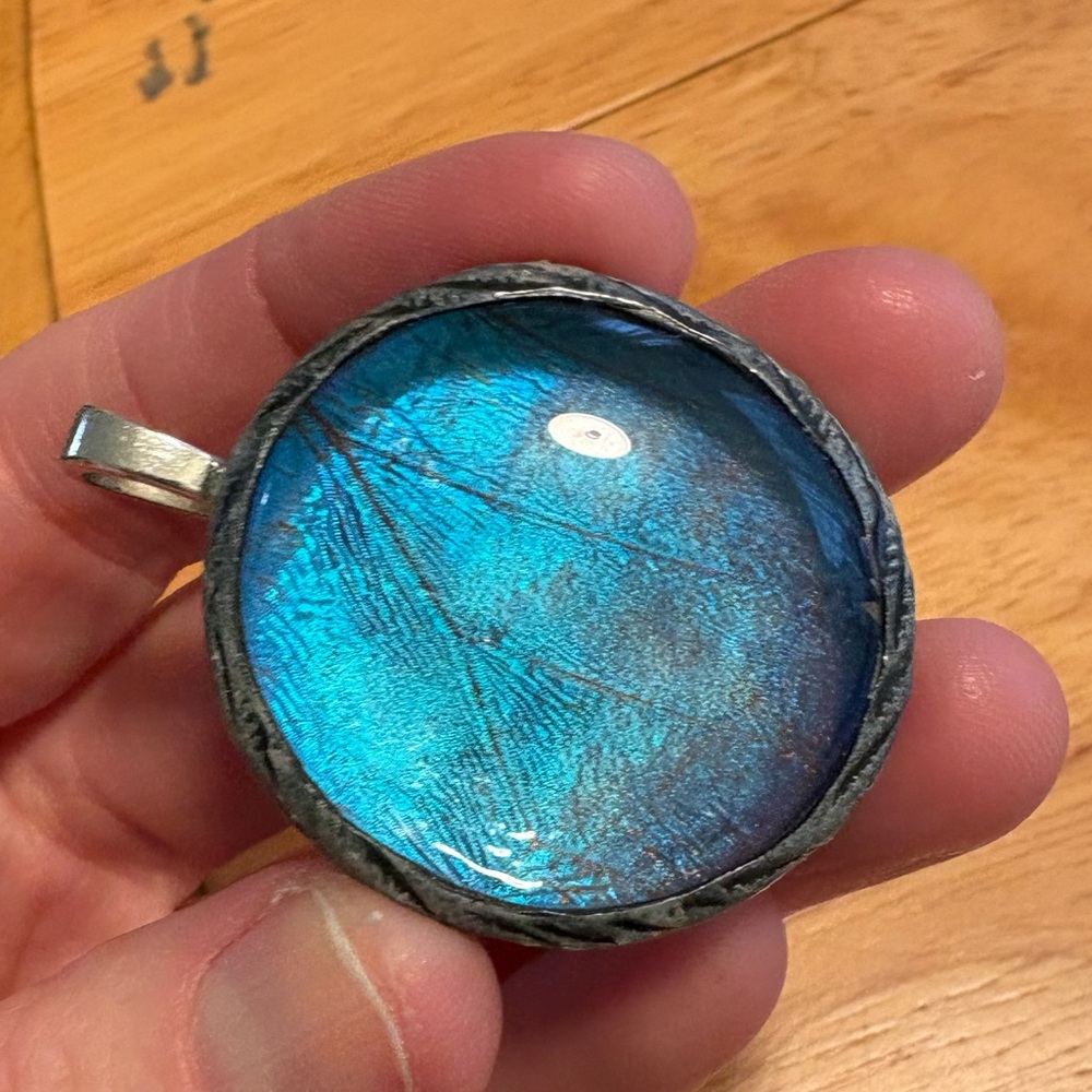 Large Blue morpho butterfly wing pendant.